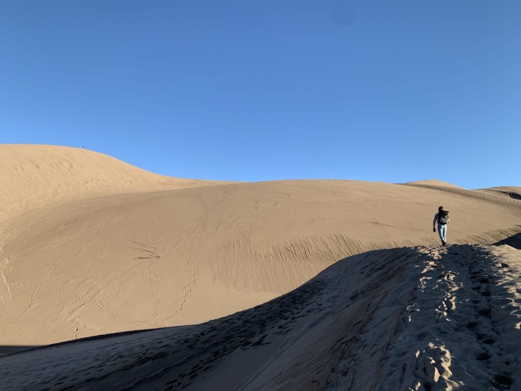 Jesse hiking the sand dunes