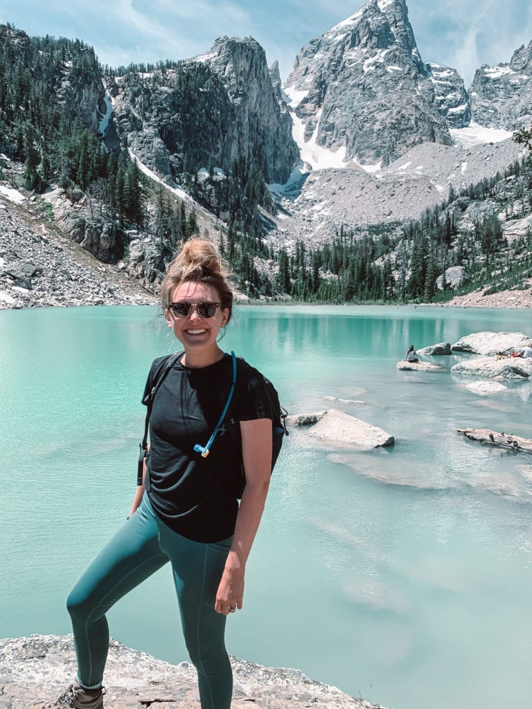 Lauren standing at the front of Delta Lake in Grand Teton